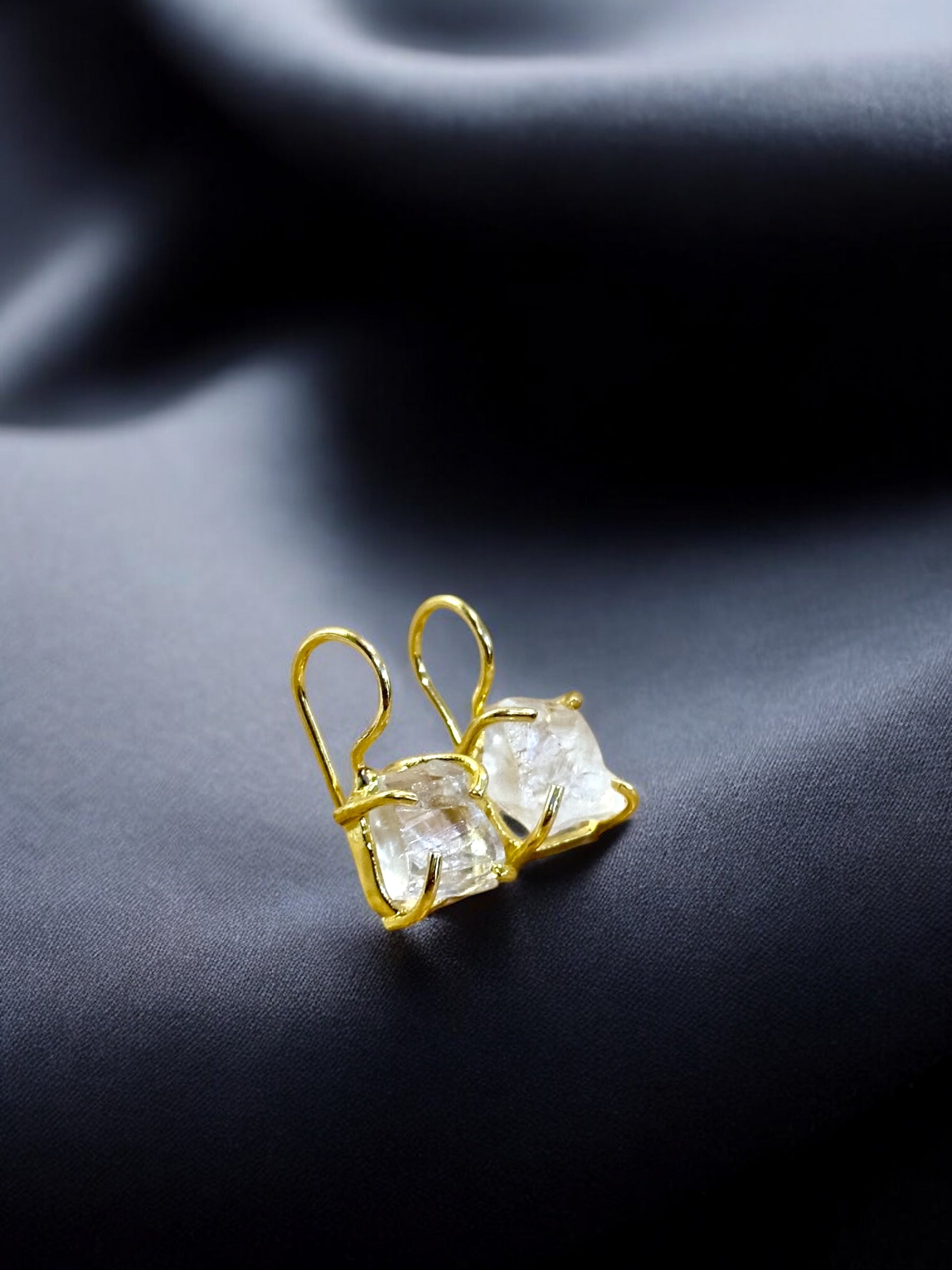 Clear quartz stone studs set in gold hooks